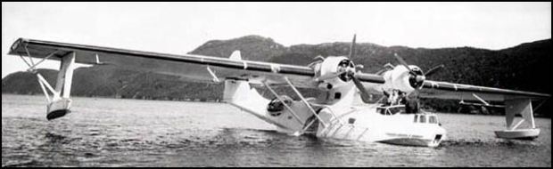 The amphibious PBY-Canso sitting in the water showing its large stature.