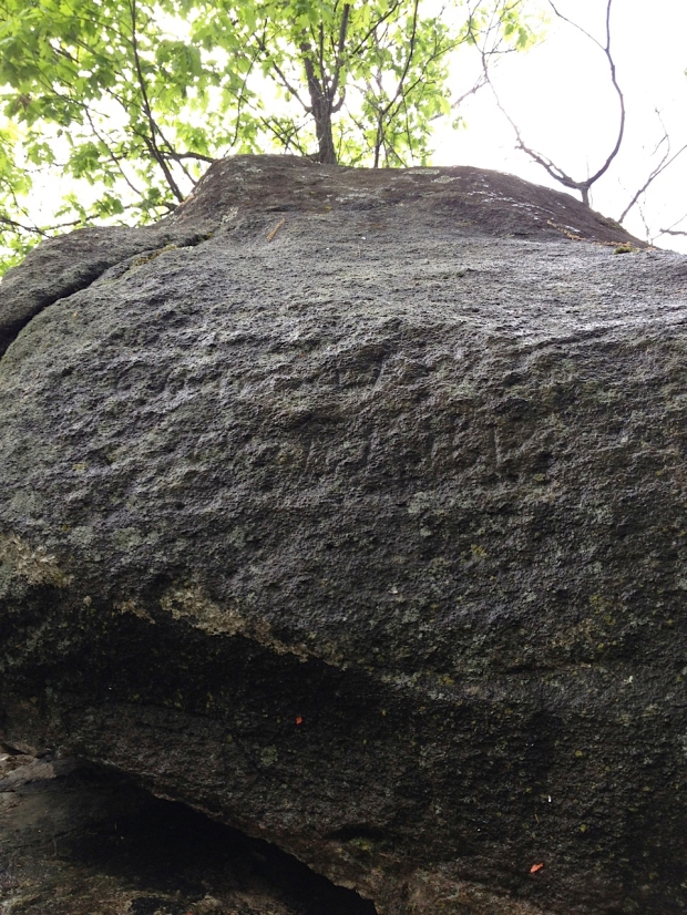 The inscription on the sone is obscured by lichen and is hardly legible.