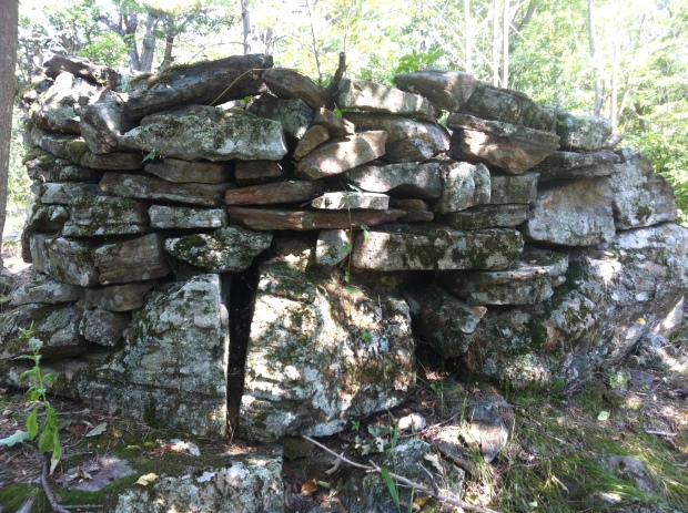 A mysterious stone structure stumbled upon in the woods high atop a geological formation.