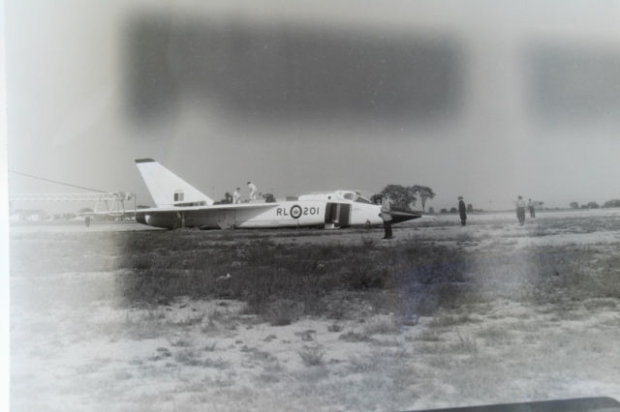 NEGATIVE 6 INVERSION: The prototype Arrow RL 201with landing gear collapsed on the Malton runway, June 11th, 1958. 